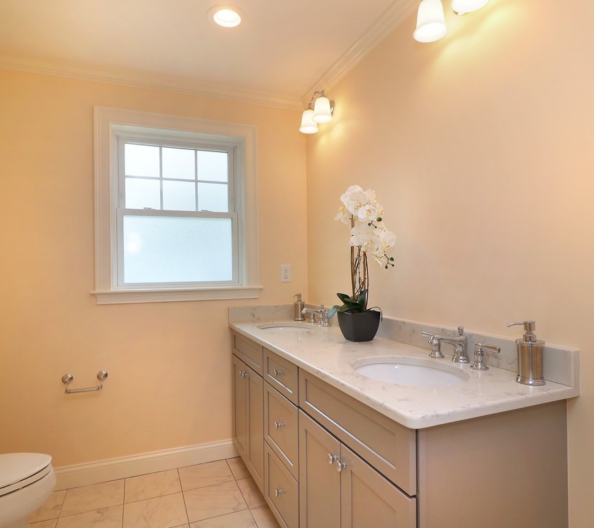6 Tower Road Arlington, MA 02474 - Photo 20 of 30 a bathroom with a sink and a mirror