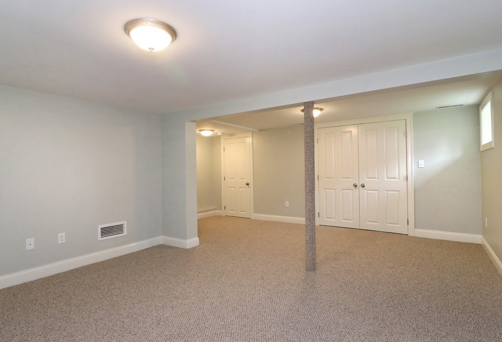 6 Tower Road Arlington, MA 02474 - Photo 28 of 30 an empty room with an entryway