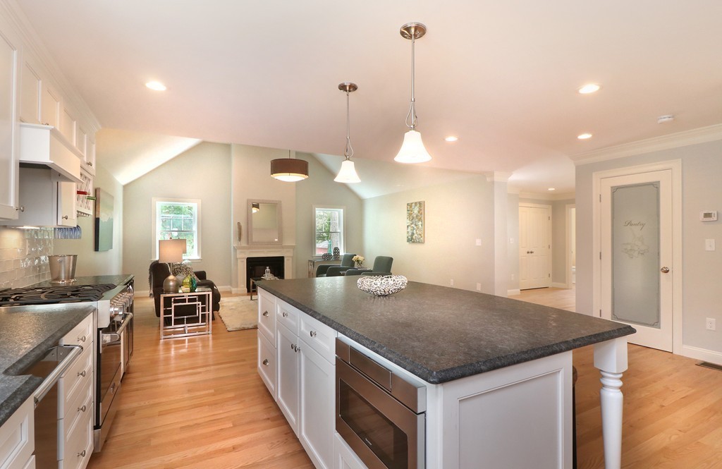 6 Tower Road Arlington, MA 02474 - Photo 6 of 30 a kitchen with stainless steel appliances granite countertop a kitchen island a stove and a sink