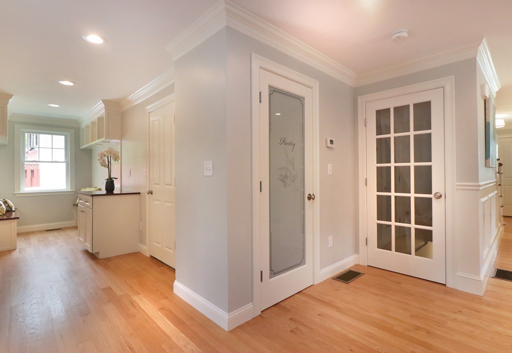 6 Tower Road Arlington, MA 02474 - Photo 9 of 30 a view of an empty room with wooden floor and a window