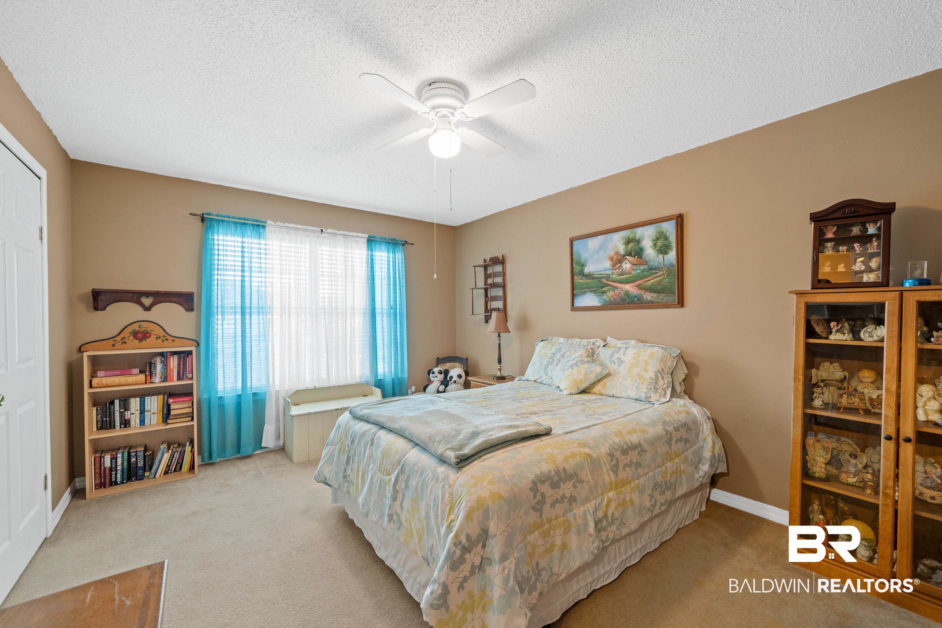 460 Ridgewood Drive Daphne, AL 36526 - Photo 22 of 31 Carpeted bedroom with a textured ceiling and ceiling fan
