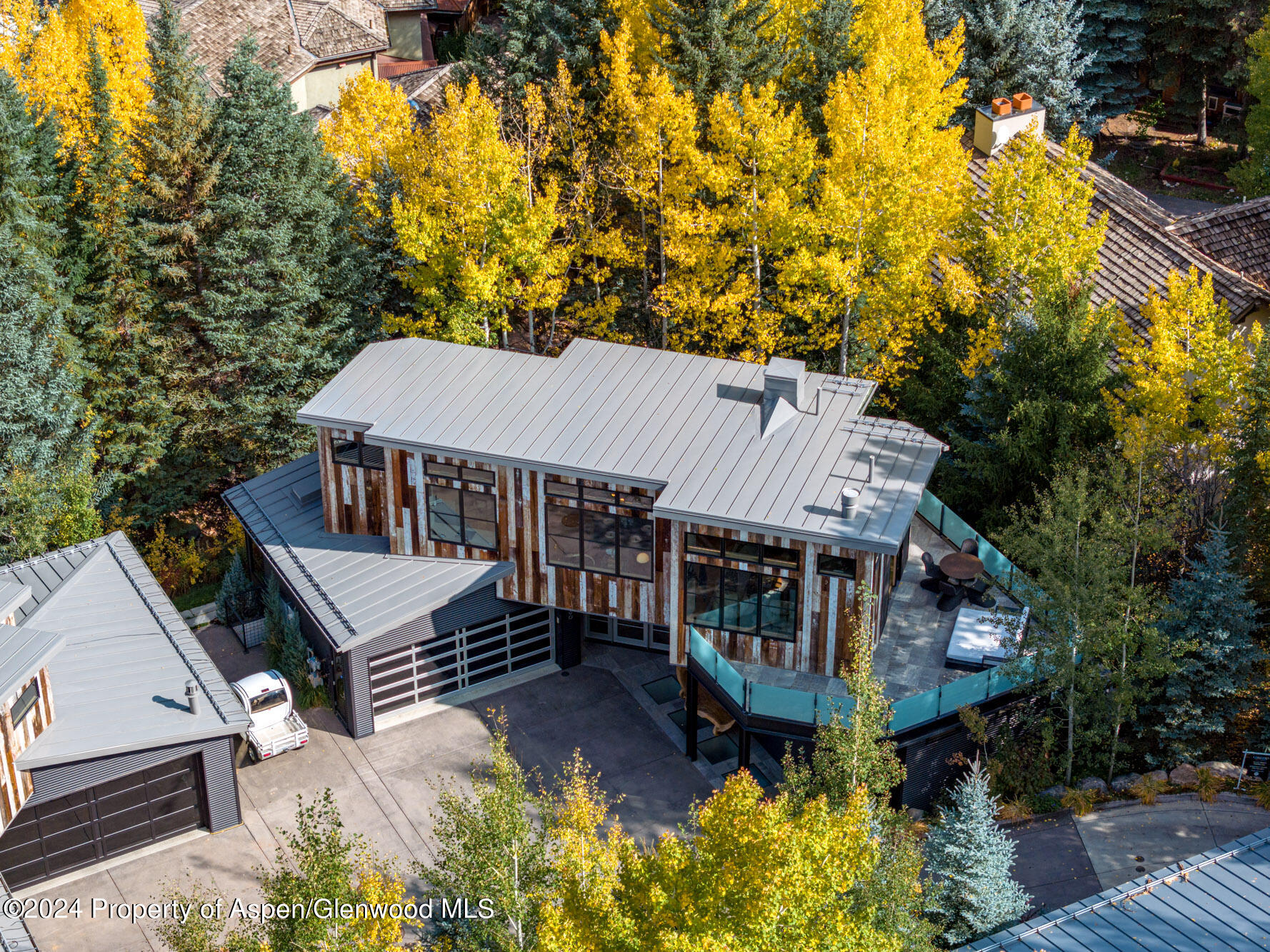 1190 Riverside Drive Aspen, CO 81611 - Photo 27 of 31 a view of a house with roof deck front of house