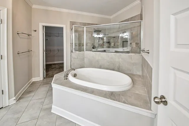 a bathroom with a granite countertop sink mirror vanity and toilet