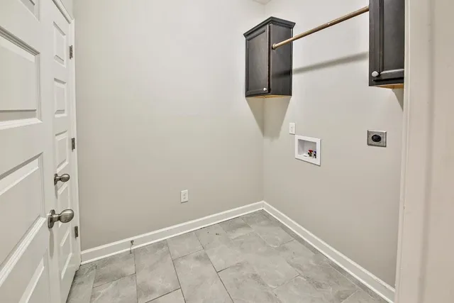 an empty room with closet and fan