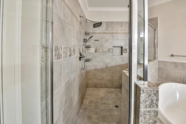 a bathroom with a sink mirror toilet and bathtub