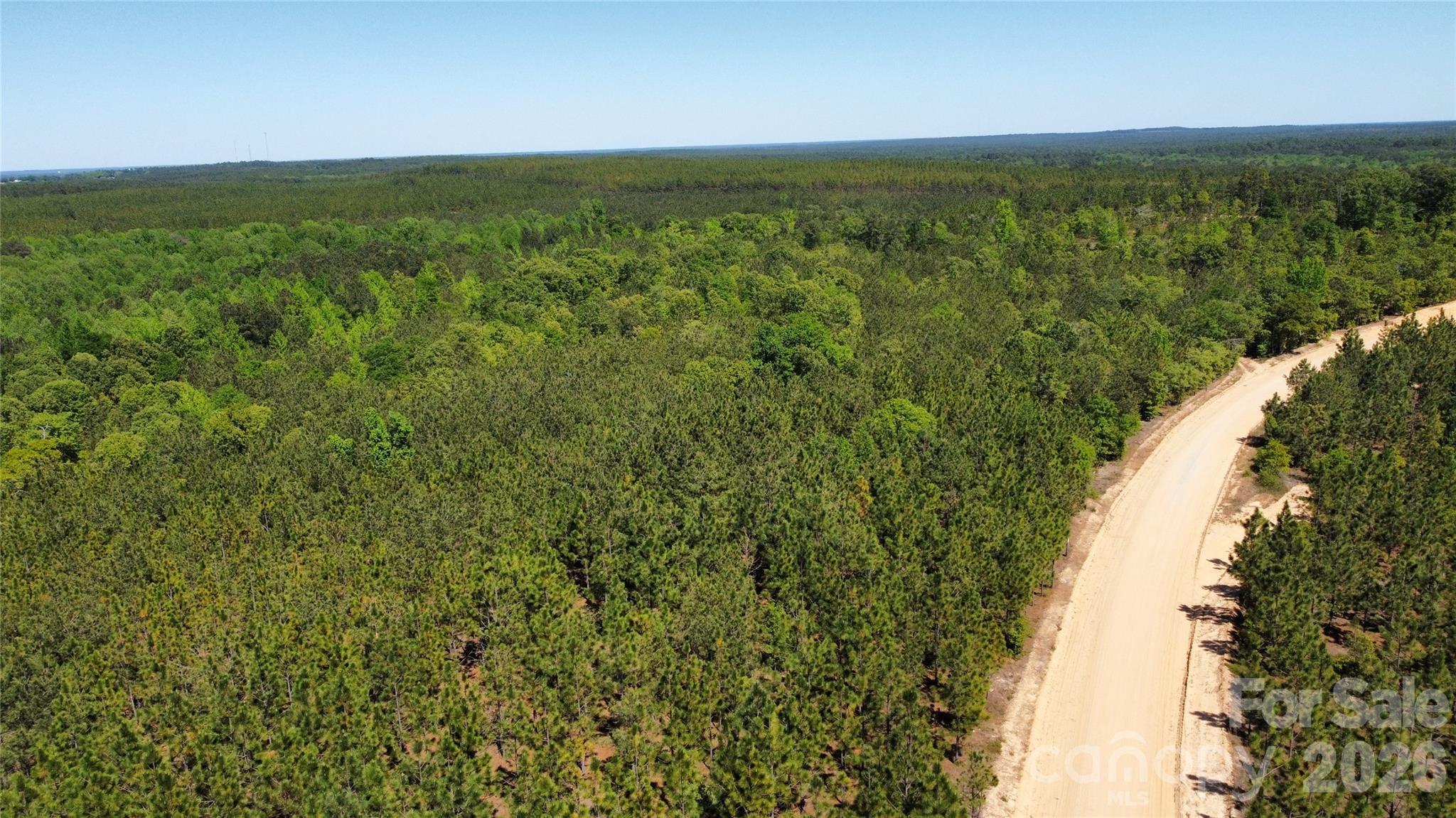 1050 McQueen Road Patrick, SC 29584 - Photo 28 of 48 a view of a lake with a city