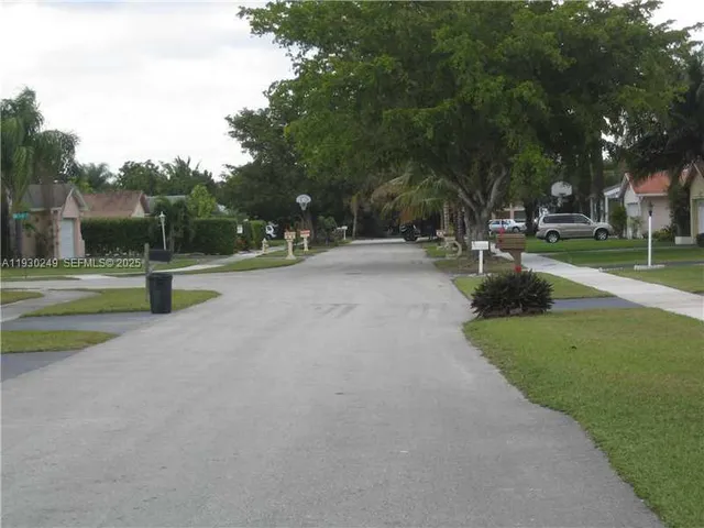 a view of a park with swings and slides