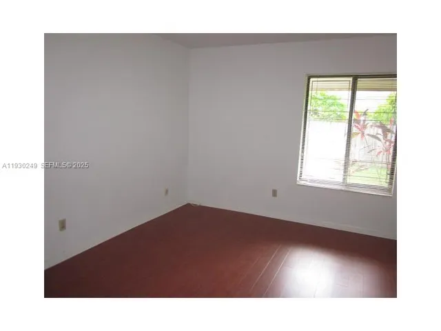 a black and white room with a window