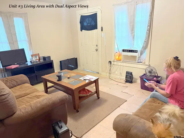 a living room with furniture and a window