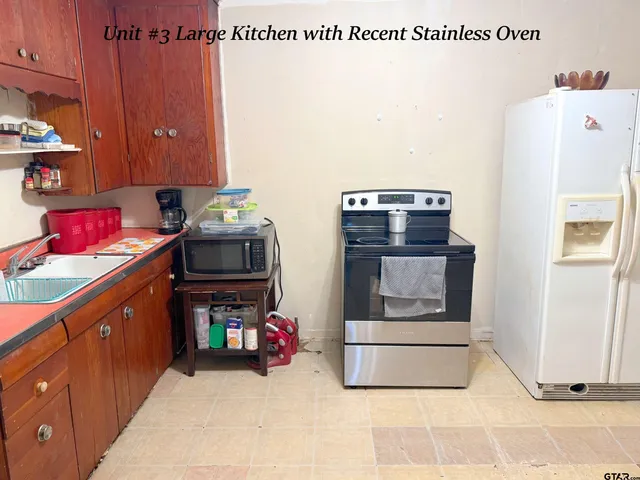 a utility room with closet dryer and washer