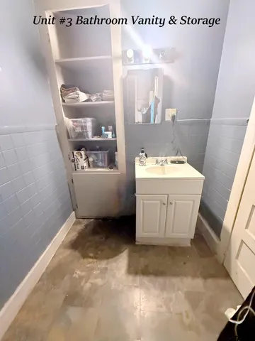 a bathroom with a sink mirror toilet and bathtub