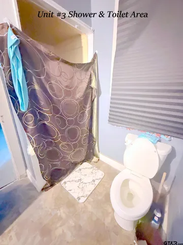 a bathroom with a bathtub and shower