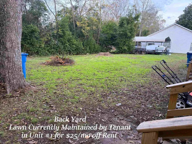 a view of a backyard with a garden