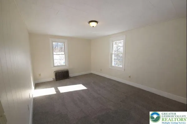 a view of an empty room and window