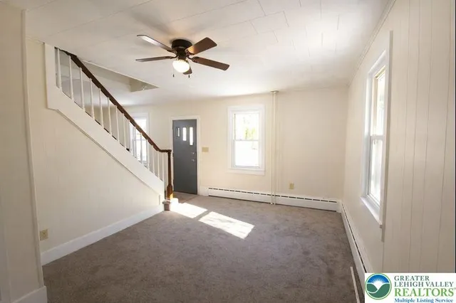 a view of an empty room with a window