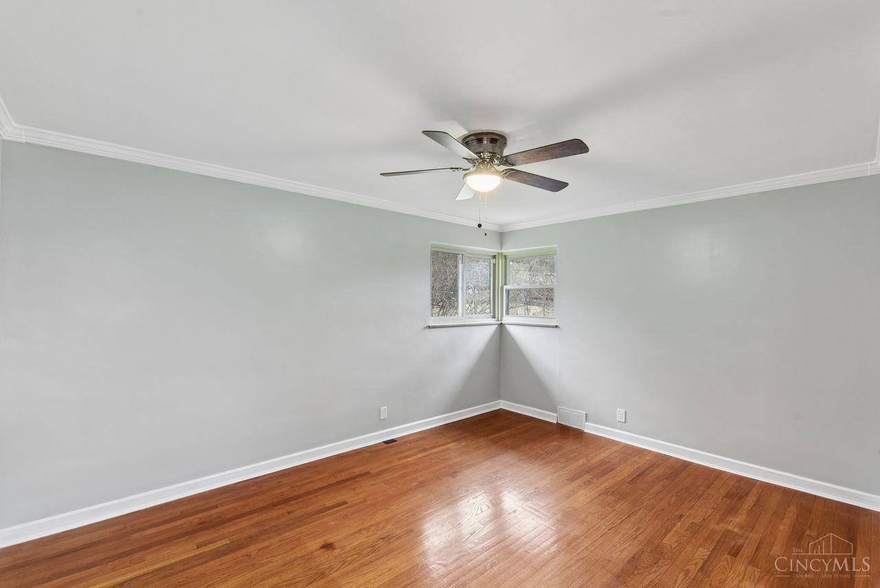 5258 Shepherd Road Cincinnati, OH 45223 - Photo 29 of 43 Here is Bedroom3! Features include a Lighted Ceiling Fan, Vinyl Windows, Wood Flooring, and a closet.