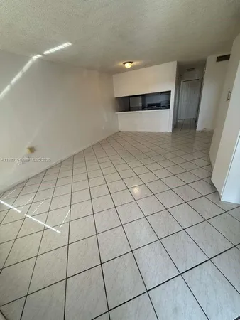 a view of an empty room and entryway