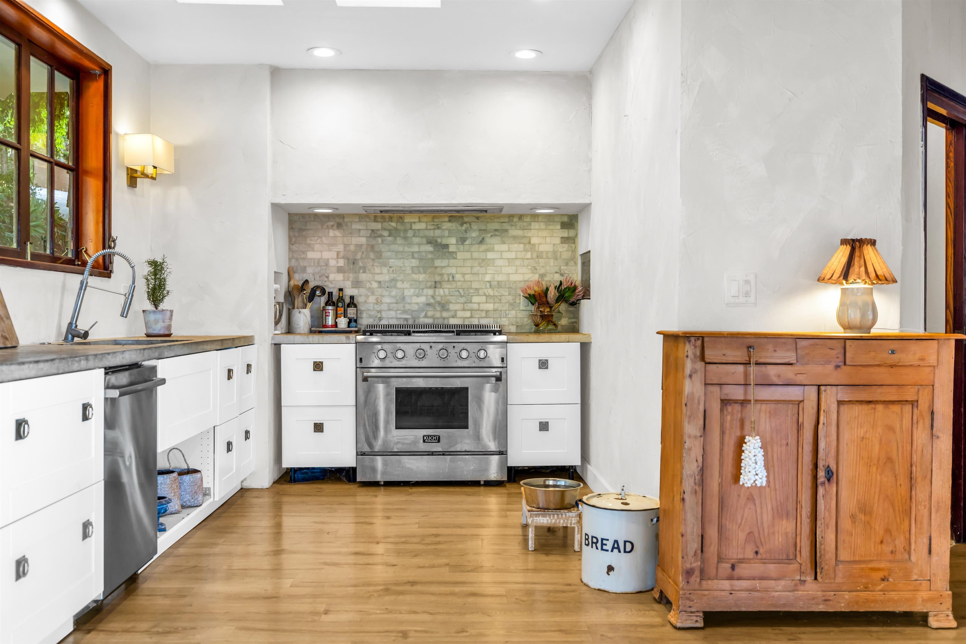 1854 Olinda Road Makawao, HI 96768 - Photo 11 of 26 a kitchen with stainless steel appliances a stove refrigerator and cabinets