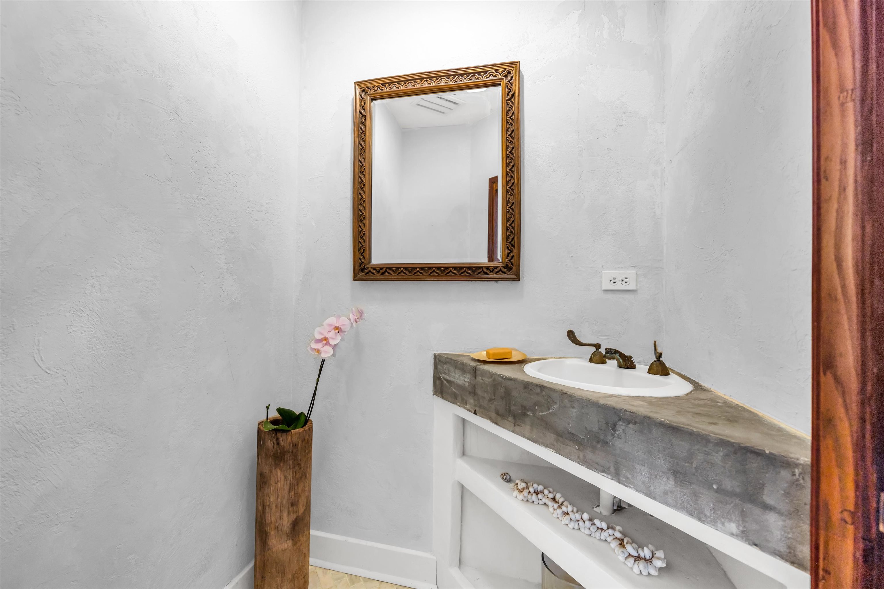 1854 Olinda Road Makawao, HI 96768 - Photo 13 of 26 a bathroom with a sink and a mirror