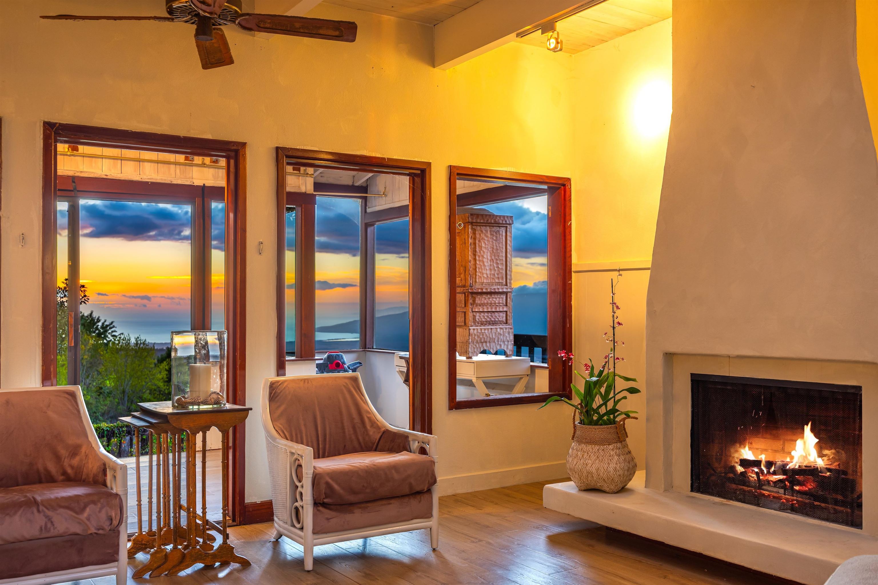 1854 Olinda Road Makawao, HI 96768 - Photo 2 of 26 a living room with furniture and a fireplace