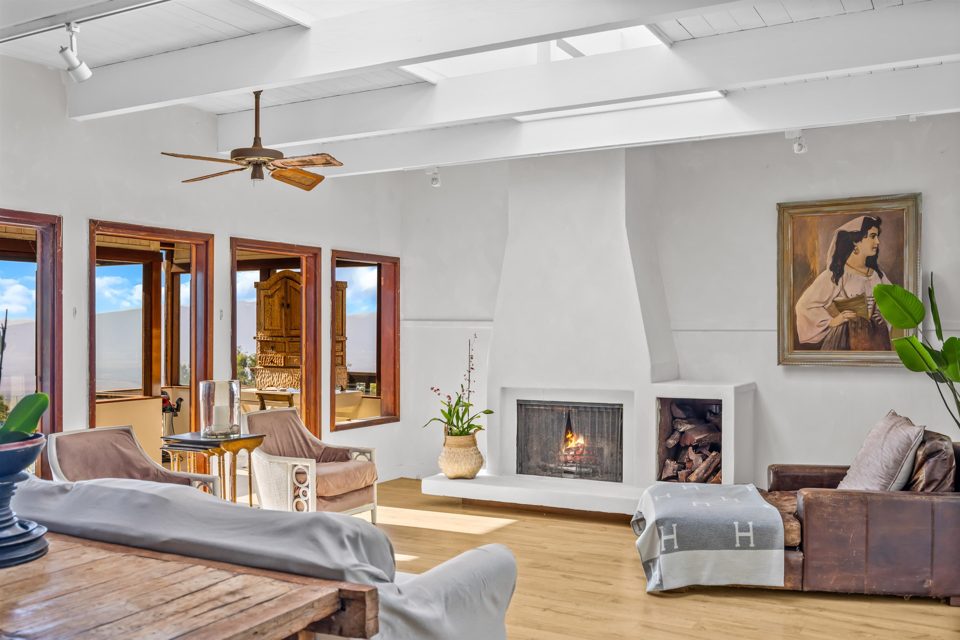 1854 Olinda Road Makawao, HI 96768 - Photo 10 of 26 a living room with furniture a fireplace and a table