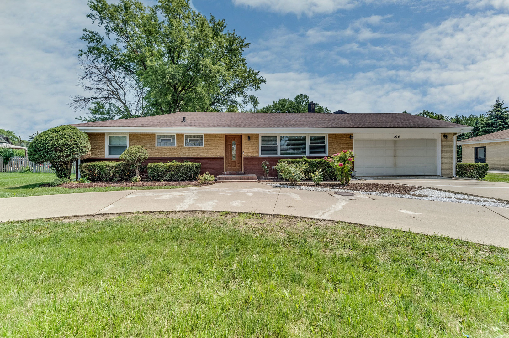 105 North Wolf Road Prospect Heights, IL 60070 - Photo 1 of 26 a front view of a house with yard and green space