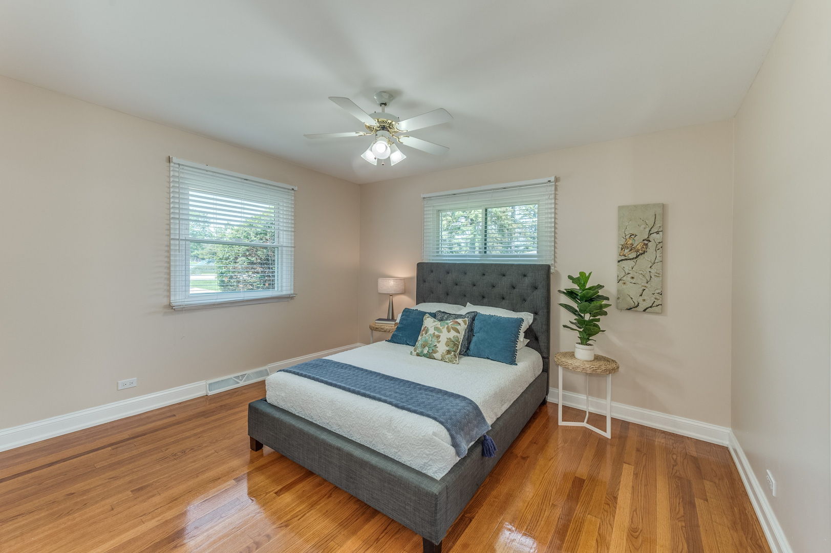 105 North Wolf Road Prospect Heights, IL 60070 - Photo 17 of 26 a bedroom with a bed lamp and wooden floor