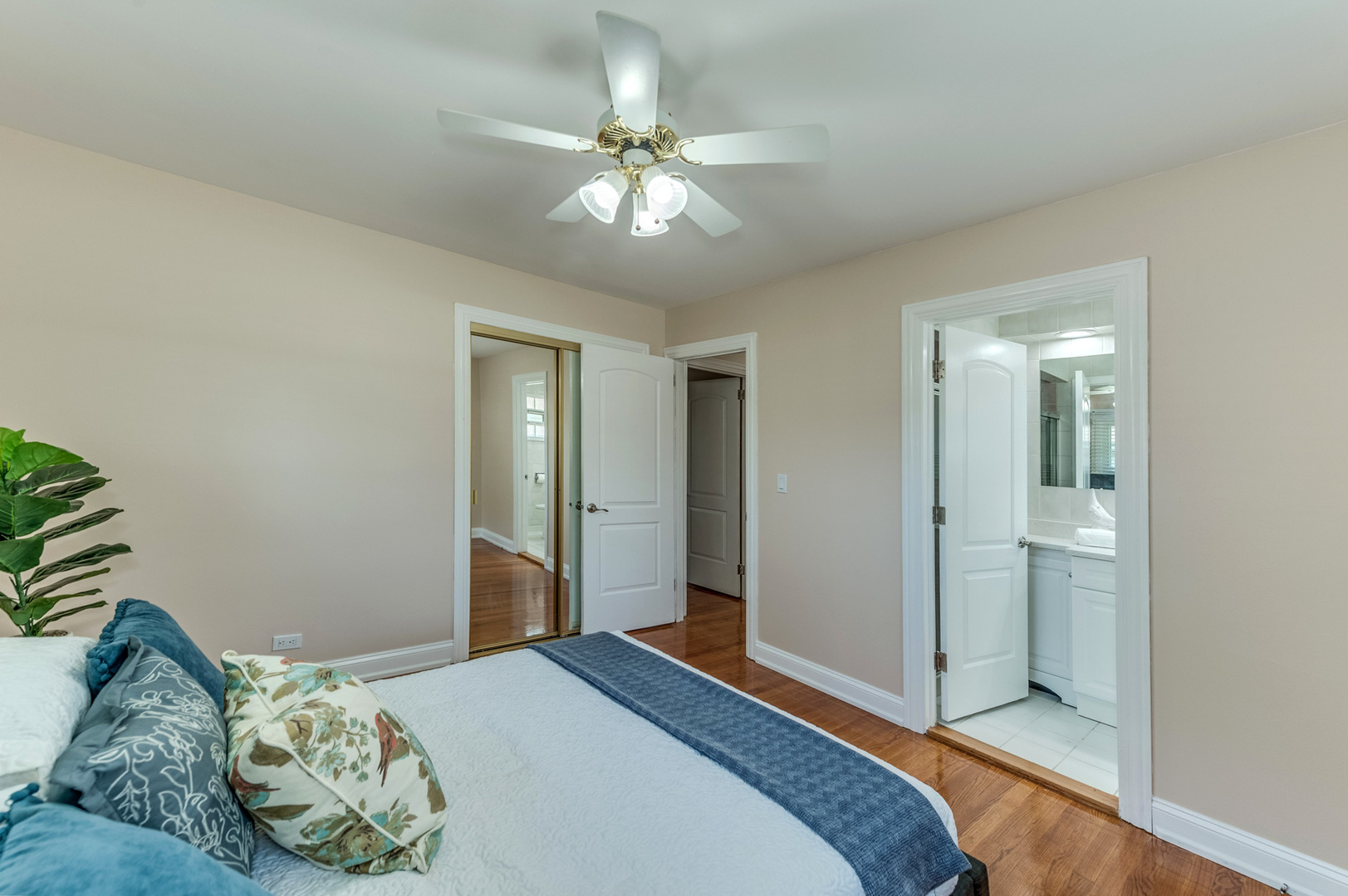 105 North Wolf Road Prospect Heights, IL 60070 - Photo 18 of 26 a bedroom with a bed and a chandelier