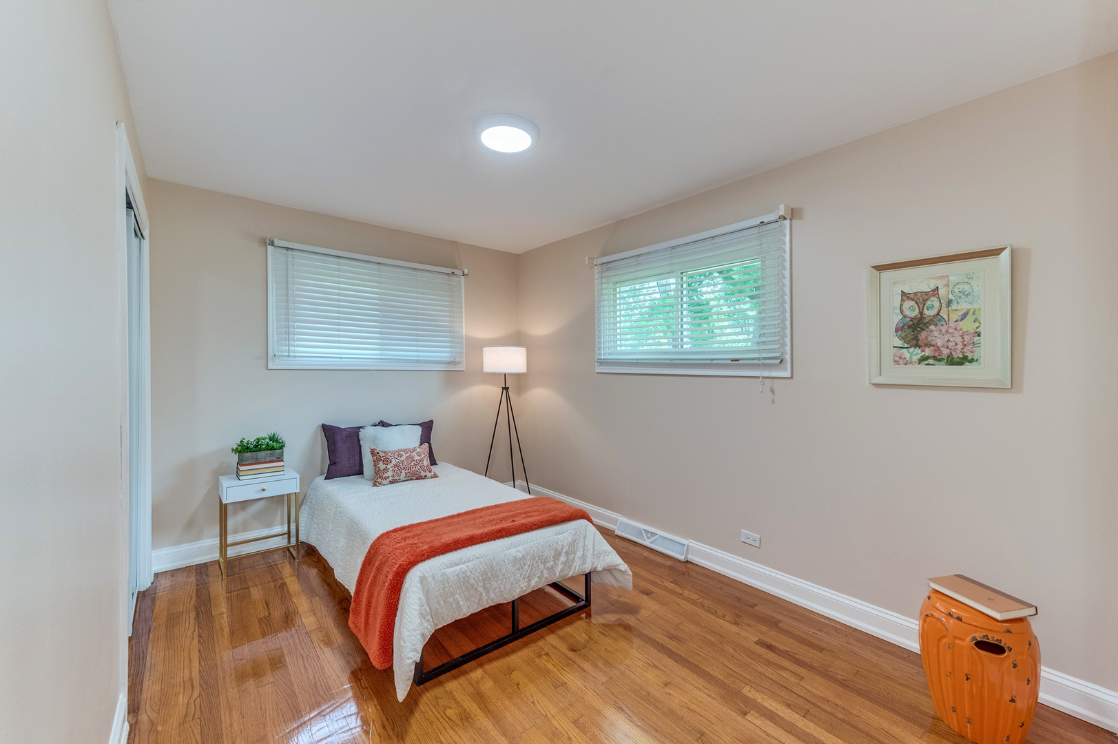 105 North Wolf Road Prospect Heights, IL 60070 - Photo 21 of 26 a bedroom with a bed and wooden floor