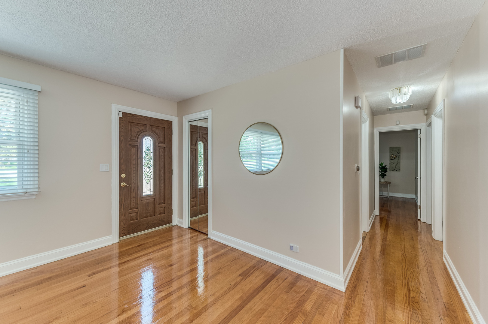 105 North Wolf Road Prospect Heights, IL 60070 - Photo 4 of 26 a view of a hallway with wooden floor