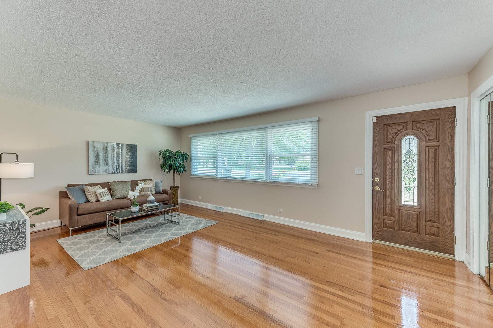 105 North Wolf Road Prospect Heights, IL 60070 - Photo 5 of 26 a living room with furniture and a window