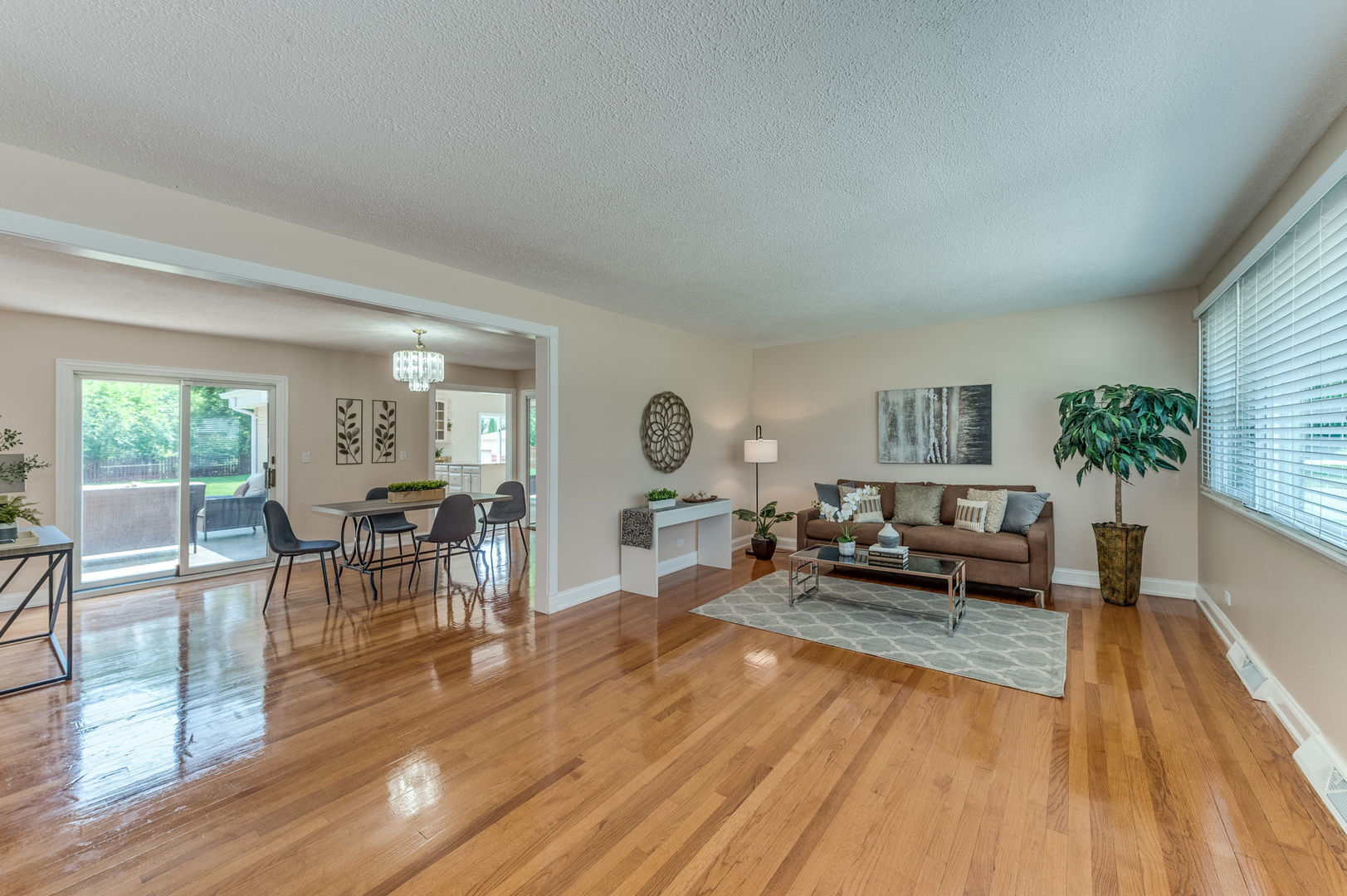 105 North Wolf Road Prospect Heights, IL 60070 - Photo 6 of 26 a living room with furniture large window and wooden floor