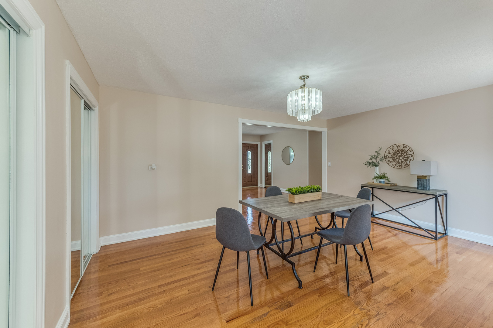 105 North Wolf Road Prospect Heights, IL 60070 - Photo 7 of 26 a view of a dining room with furniture wooden floor and a chandelier