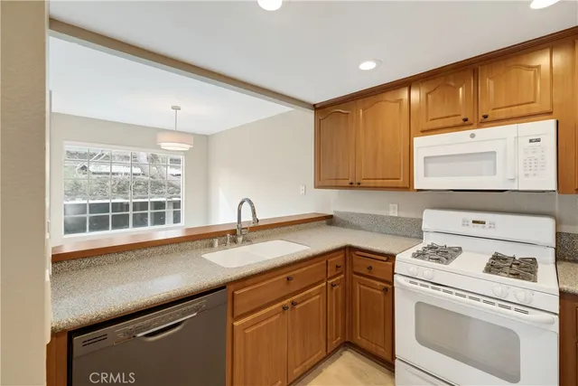 a kitchen with a sink and a window