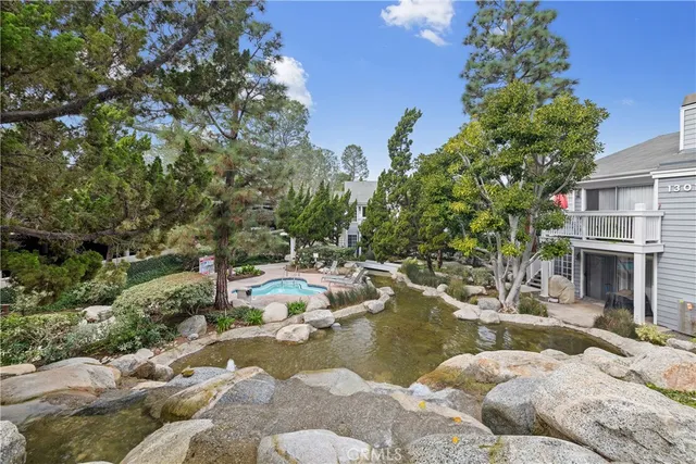 a view of swimming pool with outdoor seating