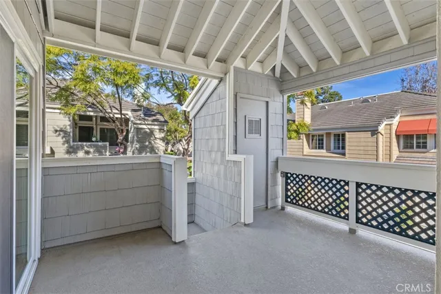 a view of a porch with wooden floor