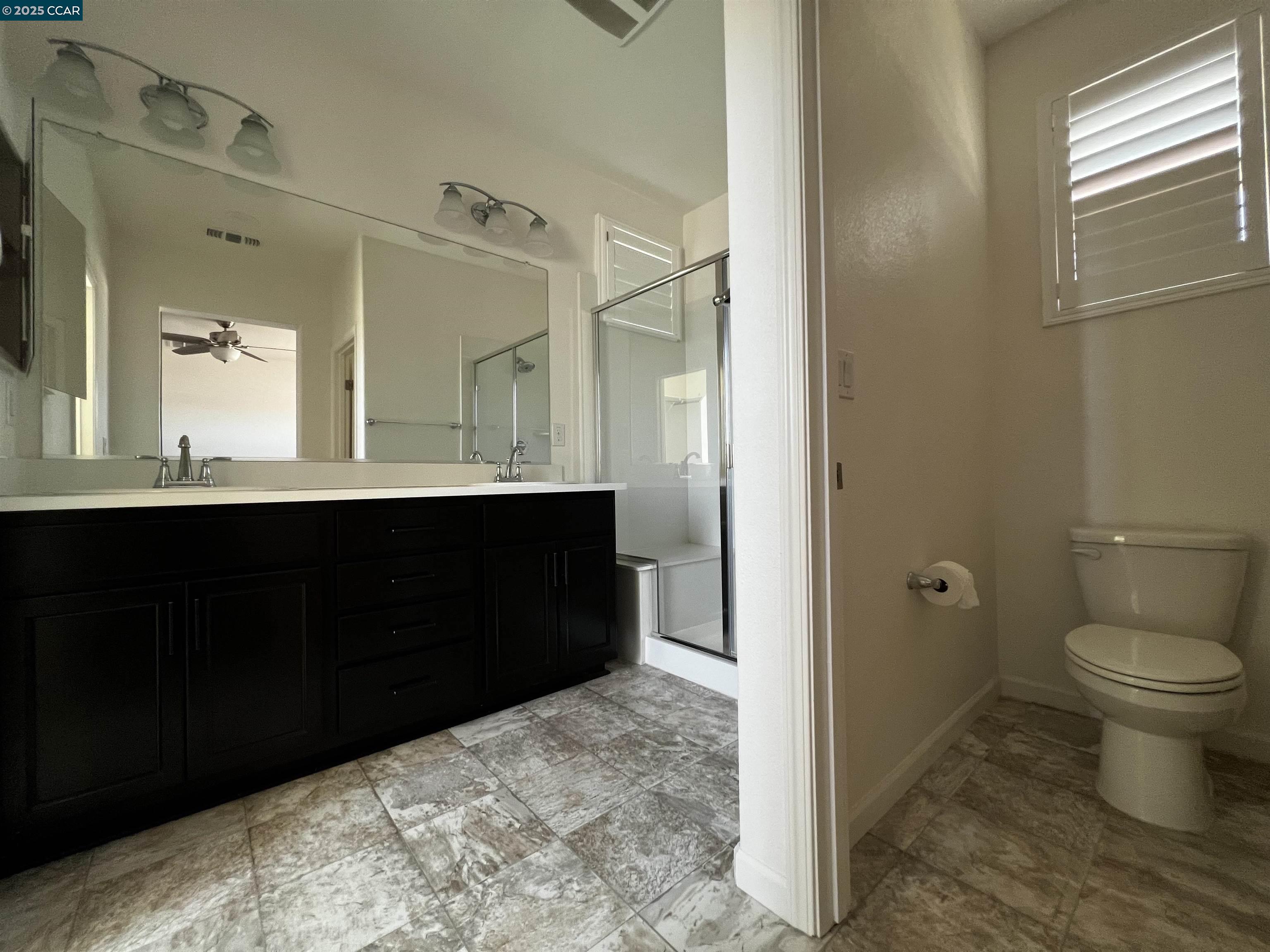 742 Iris Drive Vacaville, CA 95687 - Photo 18 of 23 a bathroom with a sink and a mirror