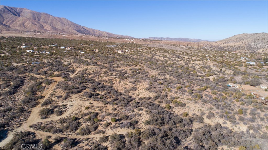 a view of a mountain range in a cloudy sky