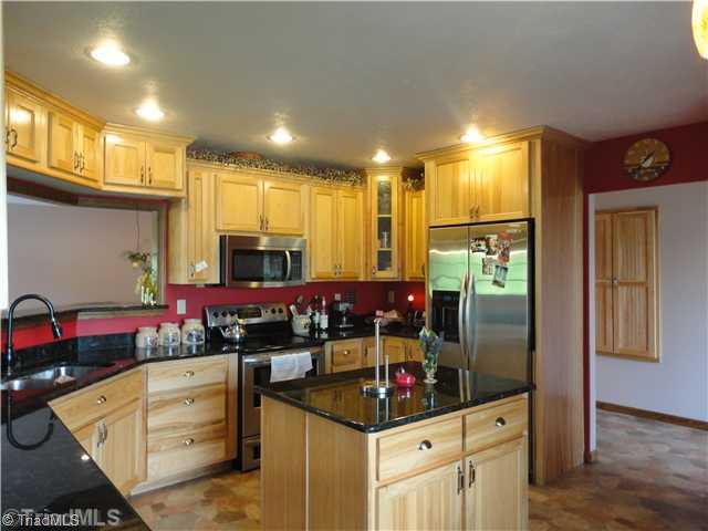 2185 South River Church Road Woodleaf, NC 27054 - Photo 2 of 15 Kitchen. Solid granite counters and a well designed kitchen equipped with a spacious pantry.