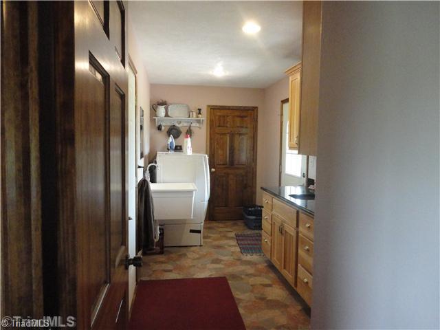 2185 South River Church Road Woodleaf, NC 27054 - Photo 6 of 15 Laundry Room. Great laundry utility space with granite counters, sink area and nice broom closet