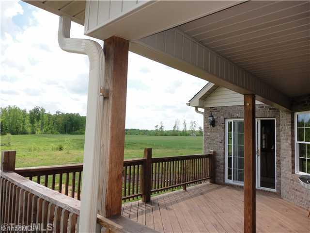 2185 South River Church Road Woodleaf, NC 27054 - Photo 10 of 15 Patio/Deck. Large deck overlooks pasture