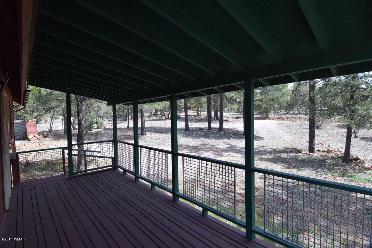 2836 Markham Road Overgaard, AZ 85933 - Photo 8 of 22 a view of a balcony with wooden floor