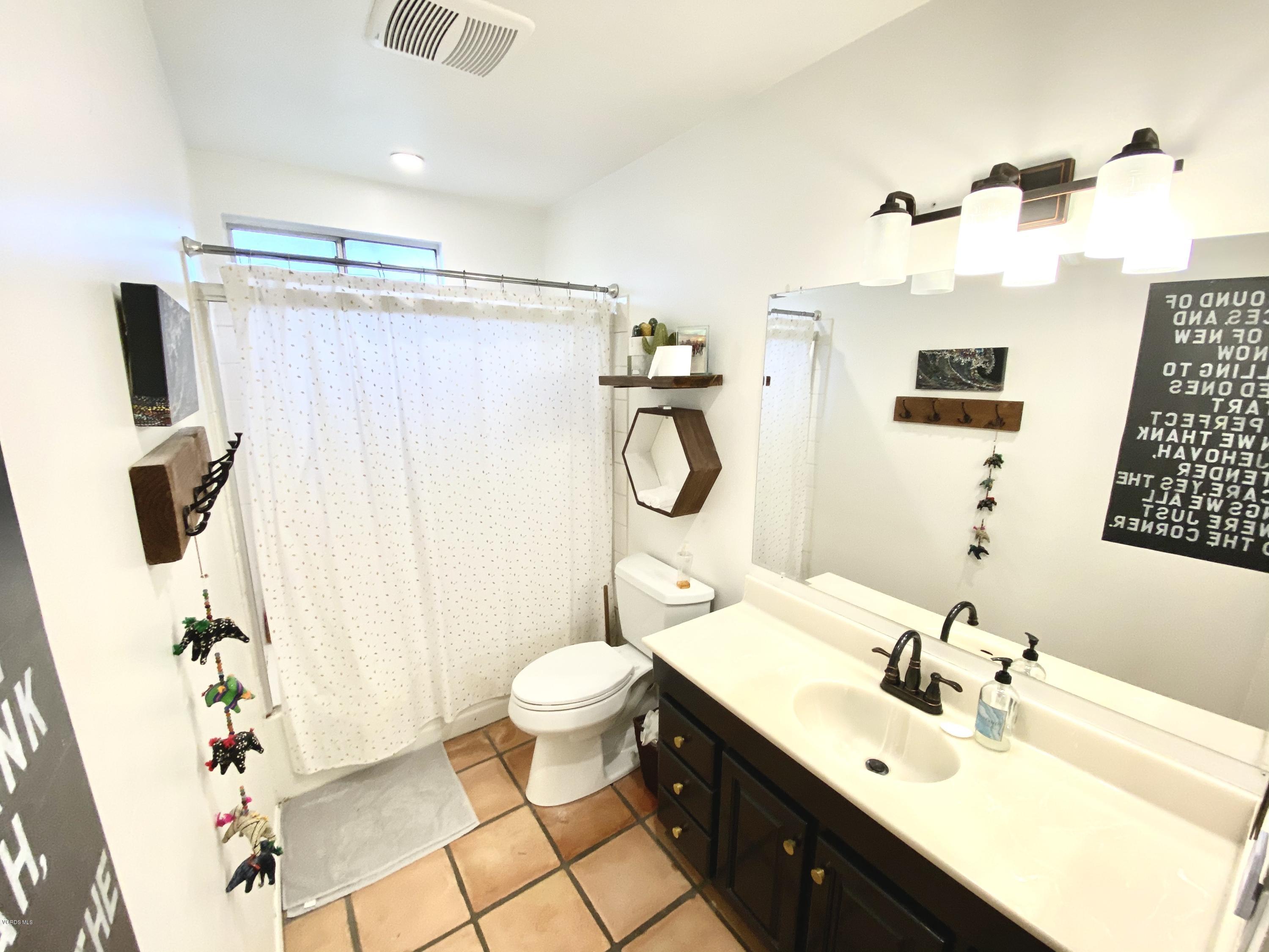 4192 Apricot Road Simi Valley, CA 93063 - Photo 14 of 22 a bathroom with a sink mirror vanity and toilet