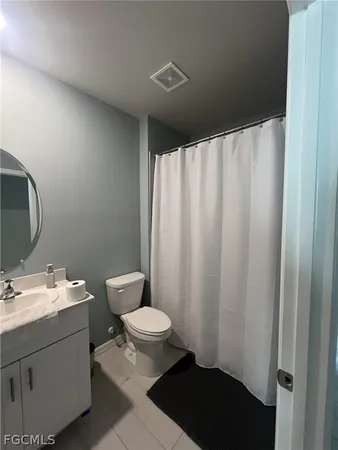 a view of hallway with wooden floor