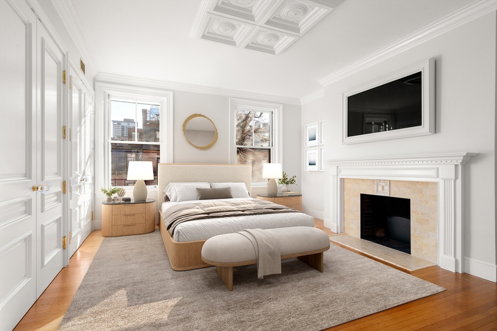 357-359 Beacon Street, Unit 4 Boston, MA 02116 - Photo 5 of 12 a bed room with a bed and a fireplace