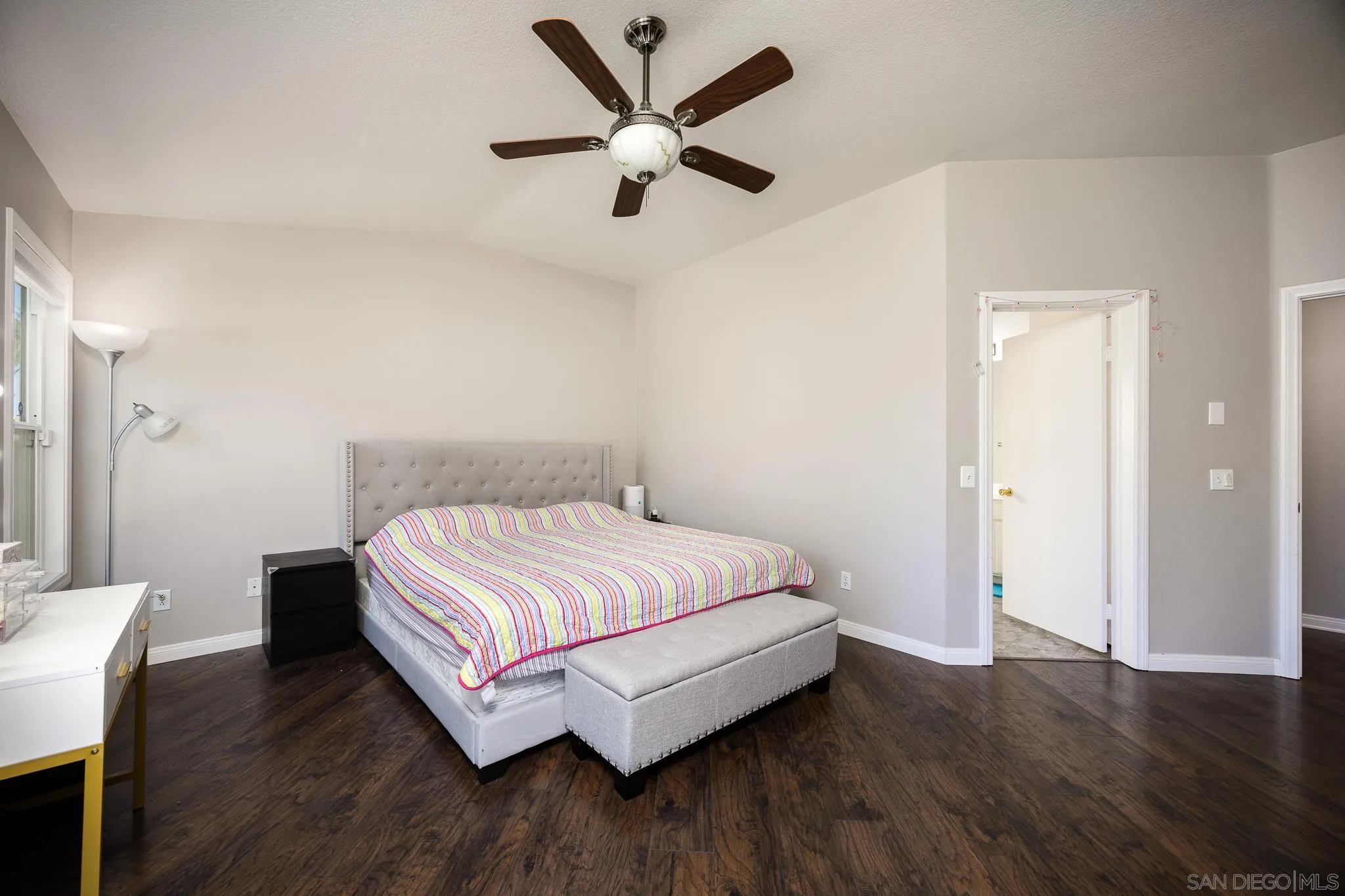 43459 Brewster Court Temecula, CA 92592 - Photo 14 of 34 a bedroom with a bed and wooden floor