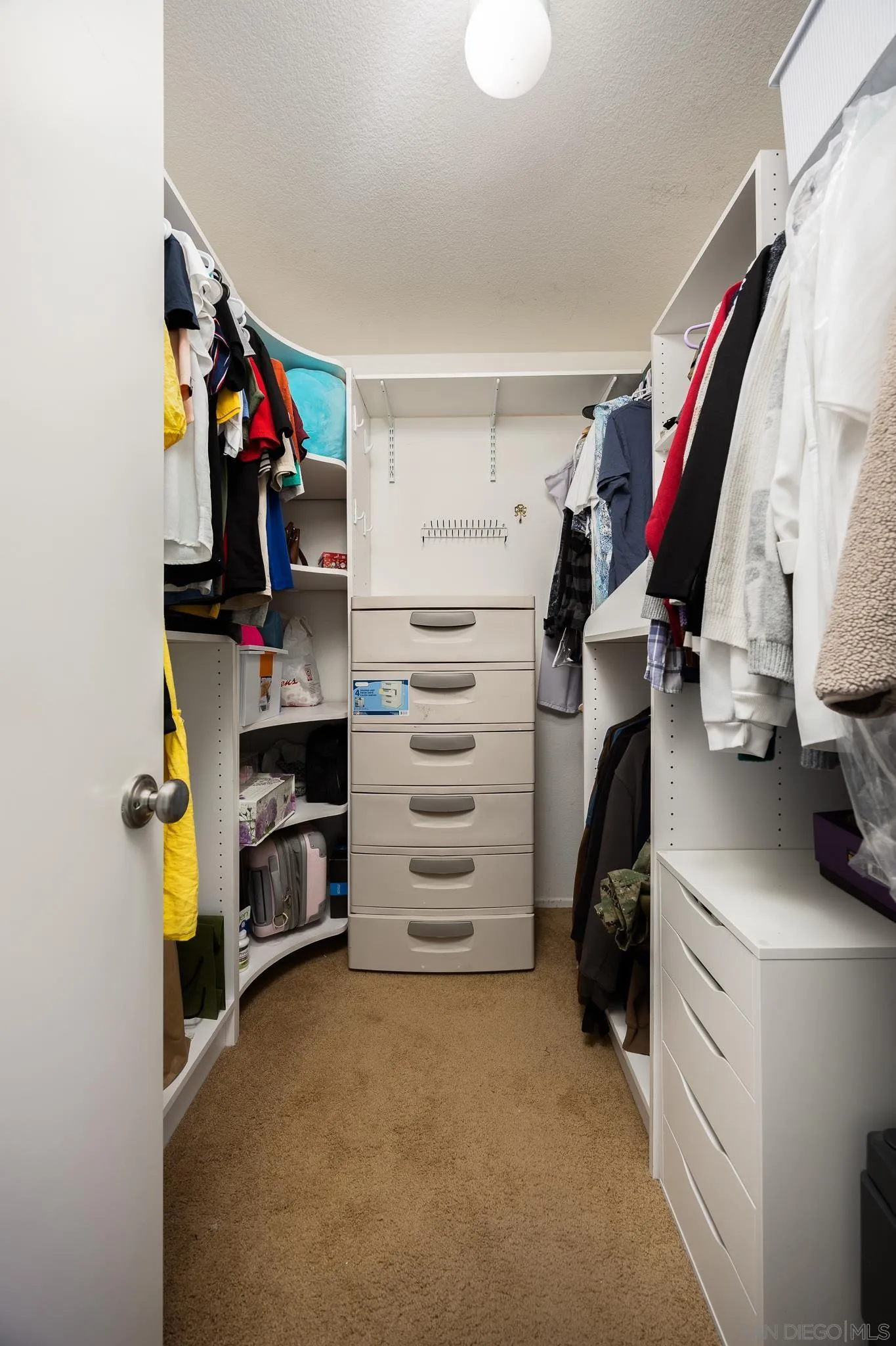 43459 Brewster Court Temecula, CA 92592 - Photo 16 of 34 a view of walk in closet with clothes and shoes