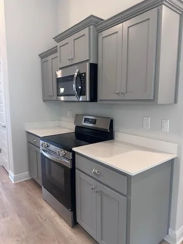 a kitchen with a sink and a stove