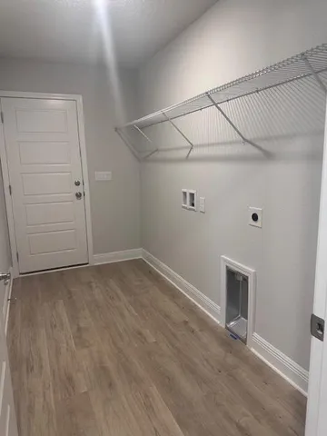 an empty room with a empty space and windows