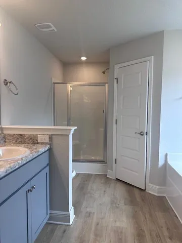 a view of a kitchen cabinets and wooden floor